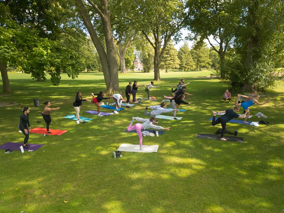 Outdoor Yoga 6 class arranged on colorful mats